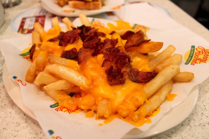 'Bacon Cheese Fries' (american fries topped with melted cheddar cheese and chopped smoked bacon)  $4.19